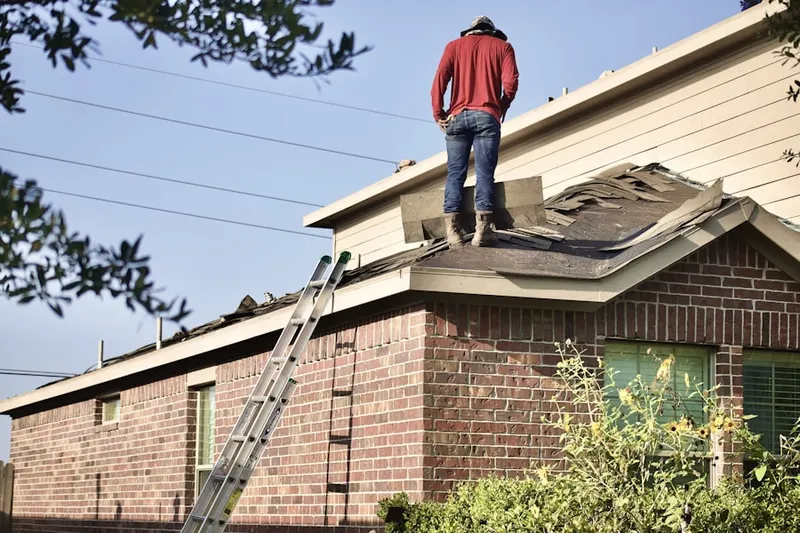 Professional roofer working on a residential roof in Downtown Mesquite